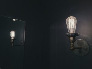 Photo smoked glass globe wall lamp
